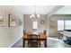 Dining room featuring natural lighting, wood flooring and seating for six at 1133 Streamside Ln, York, SC 29745