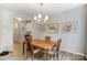 Dining room boasting decorative lighting, wood flooring and seating for four at 1133 Streamside Ln, York, SC 29745