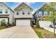 Charming two-story home featuring a stone-accented facade and a two-car garage, inviting and stylish at 1133 Streamside Ln, York, SC 29745