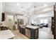 Bright, open-concept kitchen with stainless steel appliances, a large island, and seamless flow into the living area at 1133 Streamside Ln, York, SC 29745