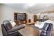 Inviting living room featuring hardwood floors and open floor plan to the kitchen area at 1133 Streamside Ln, York, SC 29745
