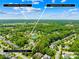 Aerial view of neighborhood amenities including tennis courts, pool, and common green spaces at 122 Laurel Glen Dr, Mooresville, NC 28115