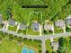 Aerial view of property on 0.38 acres surrounded by lush greenery in a suburban neighborhood at 122 Laurel Glen Dr, Mooresville, NC 28115