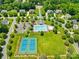 Aerial view of community pool, tennis courts, and clubhouse with lush, green landscaping at 122 Laurel Glen Dr, Mooresville, NC 28115