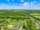 Aerial view showcasing neighborhood with community amenities, surrounded by mature trees at 122 Laurel Glen Dr, Mooresville, NC 28115