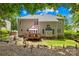 View of the back of house with deck and landscaped backyard under a bright blue sky at 122 Laurel Glen Dr, Mooresville, NC 28115