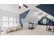 Spacious bonus room with a bed, desk, treadmill, and great natural light from the large window at 122 Laurel Glen Dr, Mooresville, NC 28115