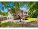 Back of the home featuring a deck, patio, fenced yard, and mature trees at 122 Laurel Glen Dr, Mooresville, NC 28115