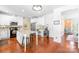 Bright kitchen features white cabinets, island, stainless steel appliances, and bar at 122 Laurel Glen Dr, Mooresville, NC 28115