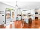 Bright kitchen features white cabinets, island, and stainless steel appliances at 122 Laurel Glen Dr, Mooresville, NC 28115