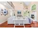 Sunlit living room with vaulted ceiling, featuring fireplace and staircase at 122 Laurel Glen Dr, Mooresville, NC 28115