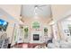 Bright living room boasts a fireplace, arched window, and soaring ceilings at 122 Laurel Glen Dr, Mooresville, NC 28115