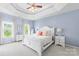 Spacious main bedroom with tray ceiling, two windows, and neutral carpet at 122 Laurel Glen Dr, Mooresville, NC 28115