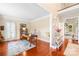 Bright home office with hardwood floors, natural light, and a comfortable work space at 122 Laurel Glen Dr, Mooresville, NC 28115