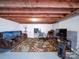 Partially finished basement with painted floors and exposed wood ceiling, ideal for creating a recreational or living area at 1614 Linwood Rd, Gaston, NC 28052