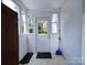 Bright entryway with a paneled door, white brick wall, and ample natural light at 1614 Linwood Rd, Gaston, NC 28052