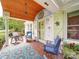Cozy front porch with an artistic ceiling, a colorful rug and lovely views of the surrounding landscape at 1614 Linwood Rd, Gaston, NC 28052