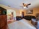 Comfortable living room with fireplace, plush seating, and seamless flow to the adjacent dining area and kitchen at 1614 Linwood Rd, Gaston, NC 28052