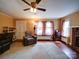 Inviting living room featuring hardwood floors, a cozy fireplace, and ample natural light through large windows at 1614 Linwood Rd, Gaston, NC 28052