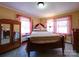 Comfortable main bedroom with traditional furnishings, natural light, and classic style at 1614 Linwood Rd, Gaston, NC 28052
