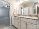 Double vanity with granite counters, framed mirror, and view of main bedroom at 174 Pine Eagle Dr, Rock Hill, SC 29732