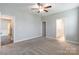 Bright, carpeted bedroom with ceiling fan and view of connecting rooms at 174 Pine Eagle Dr, Rock Hill, SC 29732
