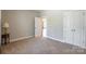 Bright bedroom with neutral walls, plush carpeting, and a view to another room at 174 Pine Eagle Dr, Rock Hill, SC 29732