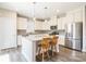 Well-lit kitchen with white cabinetry, stainless steel appliances, and granite countertops at 174 Pine Eagle Dr, Rock Hill, SC 29732
