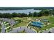 Aerial view showcasing the tennis courts, lake and common areas with clubhouse at 209 Van Gogh Trl, Mount Holly, NC 28120