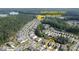 Community aerial view showcasing homes with lake access near Sunflowers Point at 209 Van Gogh Trl, Mount Holly, NC 28120