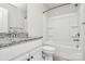 Clean bathroom with white cabinets, granite countertops, and a tub/shower combination at 209 Van Gogh Trl, Mount Holly, NC 28120