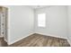Empty room with wood floors and neutral wall color at 209 Van Gogh Trl, Mount Holly, NC 28120