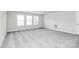 Carpeted bedroom with neutral paint and lots of natural light at 209 Van Gogh Trl, Mount Holly, NC 28120