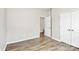 Bright, empty bedroom with wood floors and neutral wall color at 209 Van Gogh Trl, Mount Holly, NC 28120