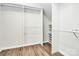 Walk-in closet features hardwood floors and built-in shelving at 209 Van Gogh Trl, Mount Holly, NC 28120