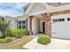 Inviting front porch with stone accents and a well-maintained lawn at 209 Van Gogh Trl, Mount Holly, NC 28120