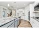 Spacious kitchen features granite counters, stainless steel appliances, and an island at 209 Van Gogh Trl, Mount Holly, NC 28120