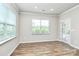 Living room featuring lots of natural light and wood flooring at 209 Van Gogh Trl, Mount Holly, NC 28120