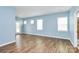 Bright living room with lots of windows and hardwood floors at 209 Van Gogh Trl, Mount Holly, NC 28120