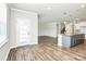 Spacious living area featuring an island and wood flooring at 209 Van Gogh Trl, Mount Holly, NC 28120