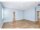 Large open living room with hardwood floors and plenty of natural light at 209 Van Gogh Trl, Mount Holly, NC 28120
