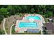 Aerial view of community pool featuring ample seating and lounge chairs at 209 Van Gogh Trl, Mount Holly, NC 28120
