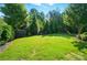 Green backyard with manicured lawn, privacy fence, and space for outdoor activities at 2246 Bluebell Way, Fort Mill, SC 29708