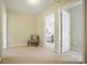 Bedroom showcasing neutral walls, carpet, a chair with a decorative pillow and a view to the bed at 2246 Bluebell Way, Fort Mill, SC 29708