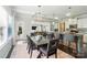 Dining room is open to kitchen and living space and features modern light fixture and ample natural light at 2246 Bluebell Way, Fort Mill, SC 29708