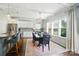 Open concept kitchen and dining room boasts updated light fixtures and lots of natural light at 2246 Bluebell Way, Fort Mill, SC 29708