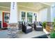 Inviting front porch with stone accents and comfortable seating area to enjoy outdoor living at 2246 Bluebell Way, Fort Mill, SC 29708