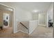 Upstairs hallway with neutral walls, carpet, and natural light, connecting bedrooms and living areas at 2246 Bluebell Way, Fort Mill, SC 29708