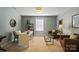 Neutral home office boasts a modern desk, comfortable seating, and bright natural light at 2246 Bluebell Way, Fort Mill, SC 29708