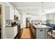 Modern kitchen boasts granite counters, stainless appliances, white cabinets and an island with bar seating at 2246 Bluebell Way, Fort Mill, SC 29708